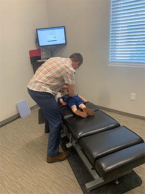 Chiropractor Flower Mound TX Dale Leonard Adjusting Child